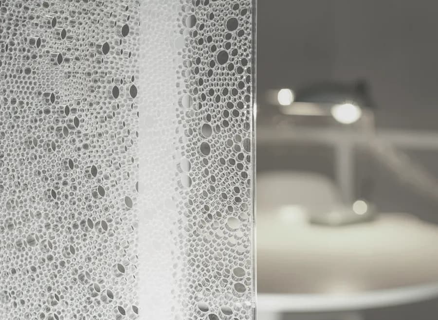 Close view of the satin honeycomb panel of a BePod with a lamp behind it