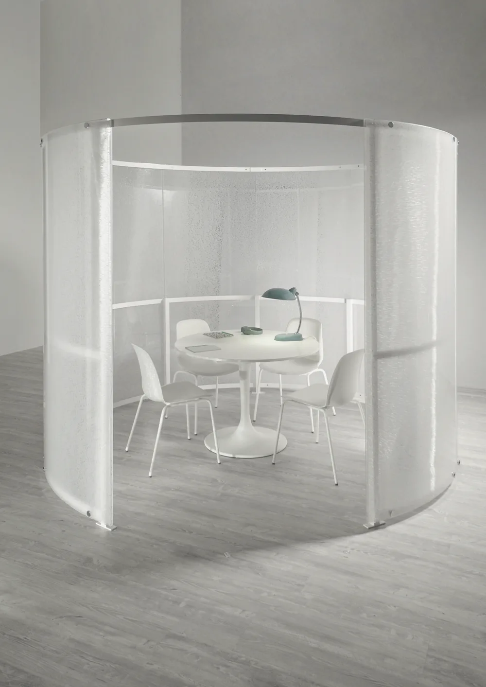 BePod circular self-standing meeting pod in satin translucent panels with a round table and chairs inside