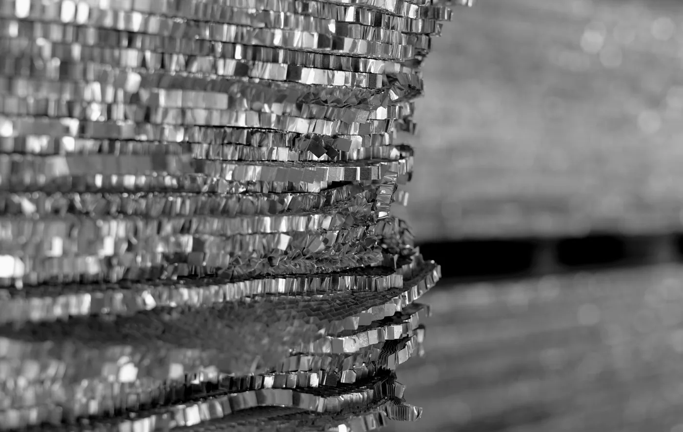 Macro view of the layered edge of a Bencore composite panel