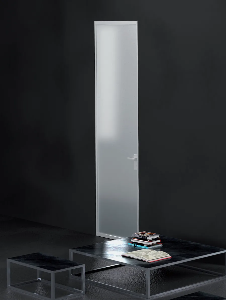 Fos 45 flush to wall swing door with a translucent panel in a dark room
