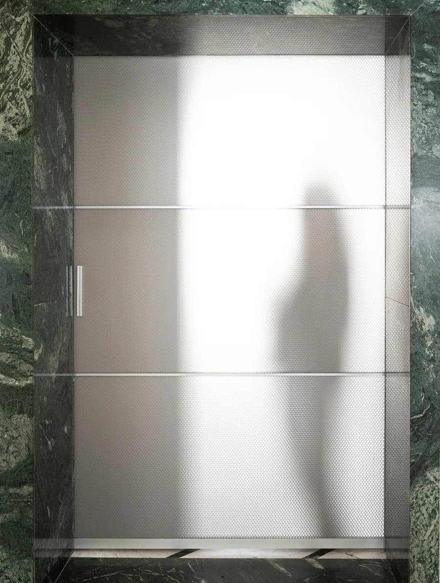 Fos 90 two wing door with a hexagonal honeycomb panel in a dark frame