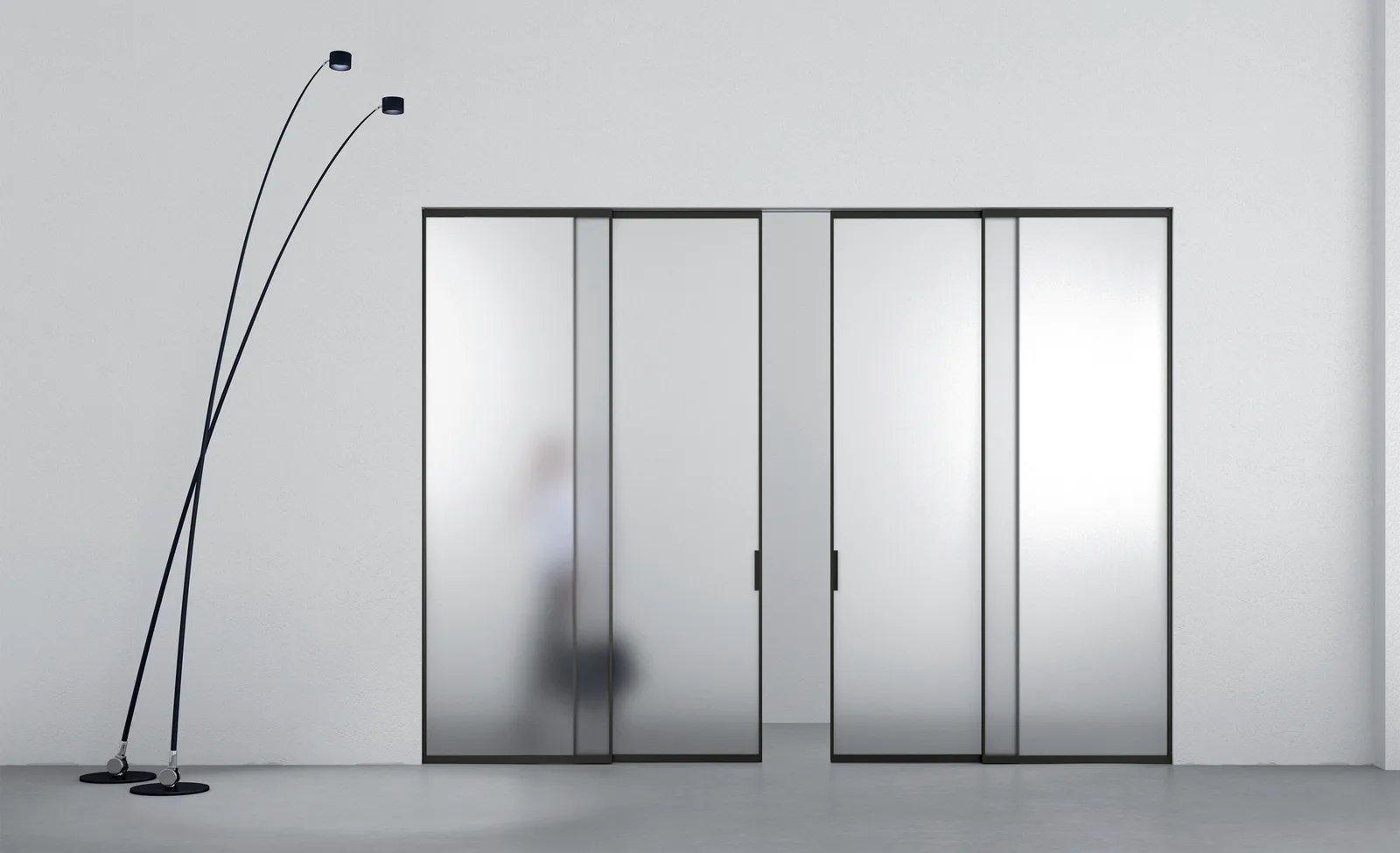 Fos 90 four wing sliding door on a concealed top track, with a floor lamp beside it