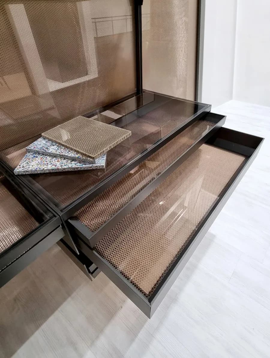 Drawer unit in a Loop closet with sample panels resting on it