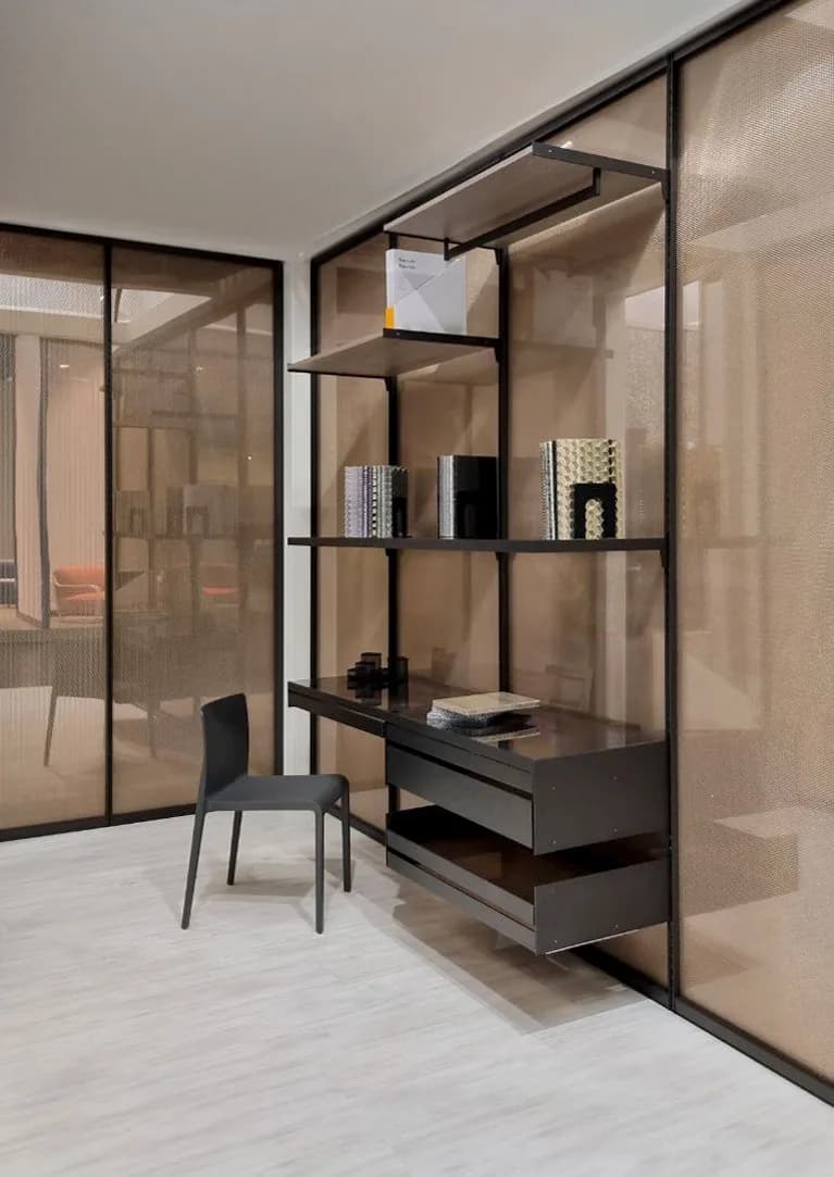 Loop walk-in closet with translucent bronze Bencore panel walls, a desk and shelving inside