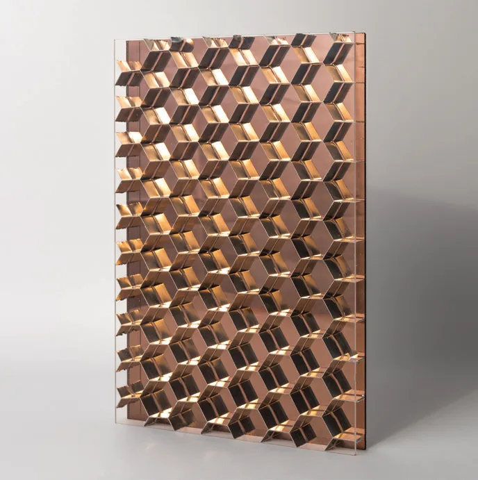 Mirror panel sample in bronze, the hexagonal core faceting the reflection