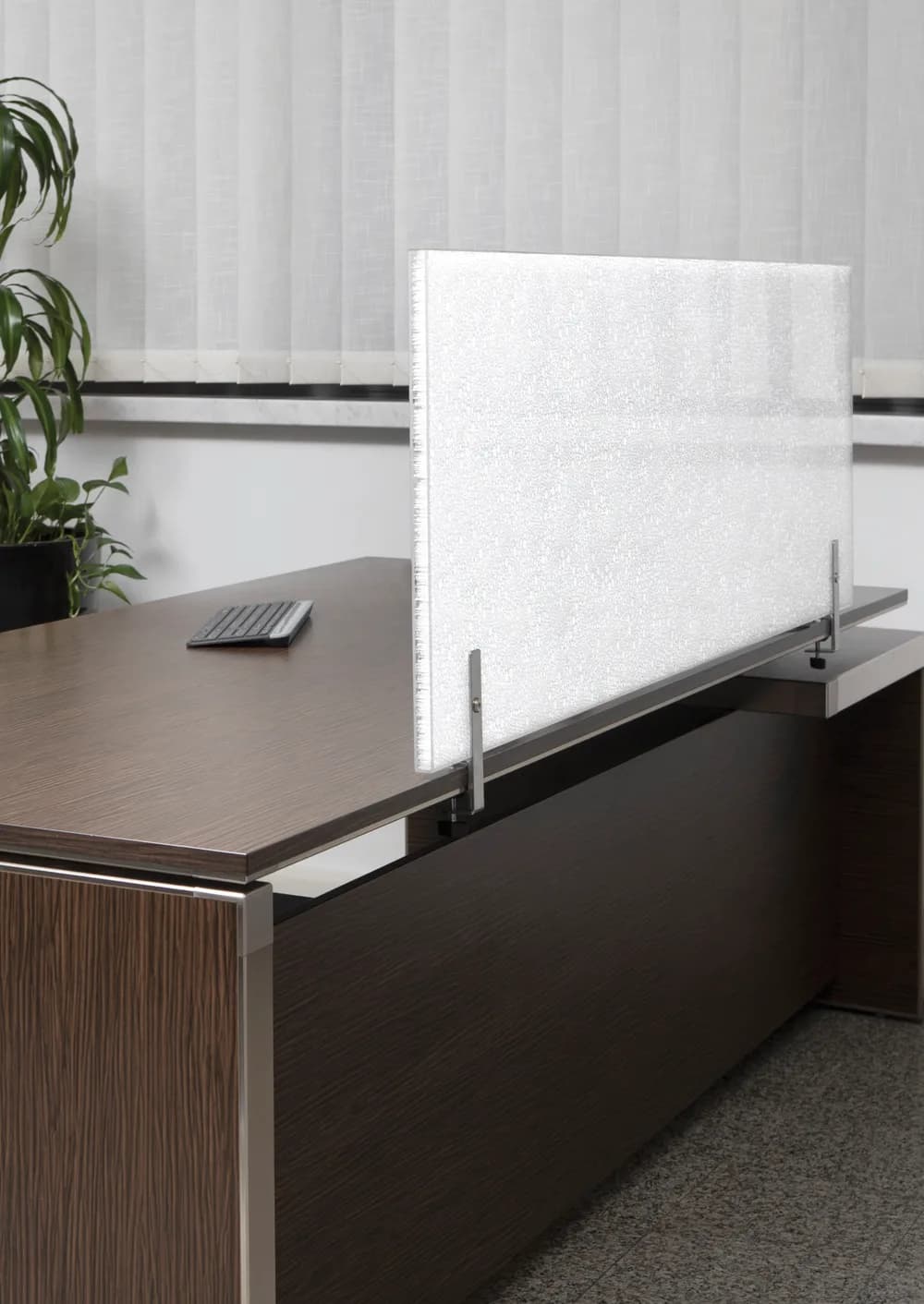 Lightben Acoustic panel used as a white translucent desk screen on a dark wood desk