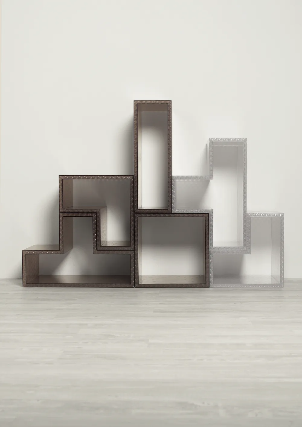 Tetris elements in bronze Starlight stacked on a floor