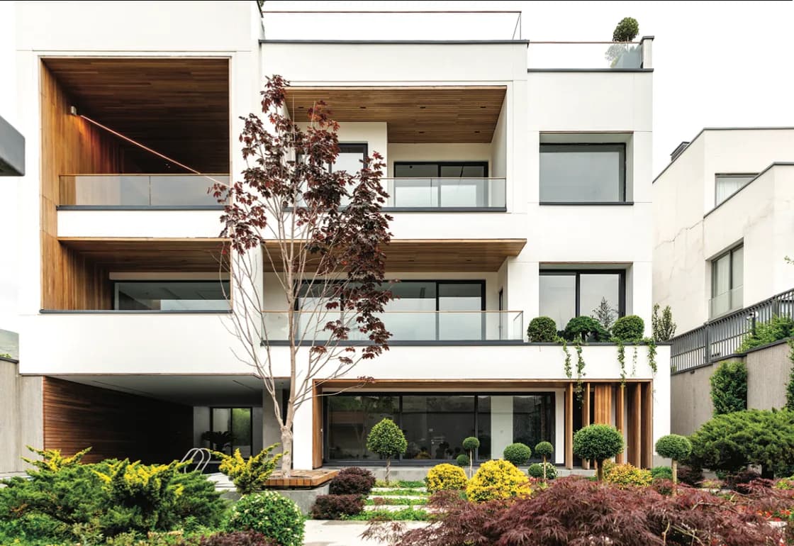 Private villa residence exterior with balconies and garden