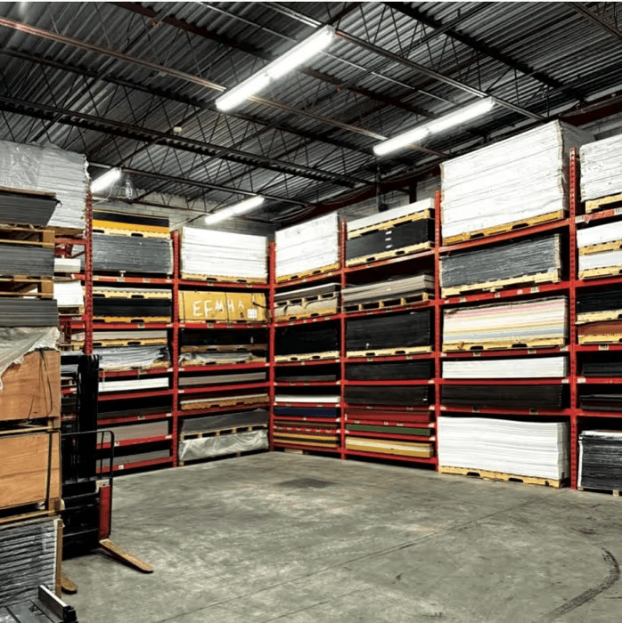 Plastic sheets stocked on warehouse racking at FIDAR System's North York, Ontario facility - acrylic, PVC, polycarbonate, and ACM panels