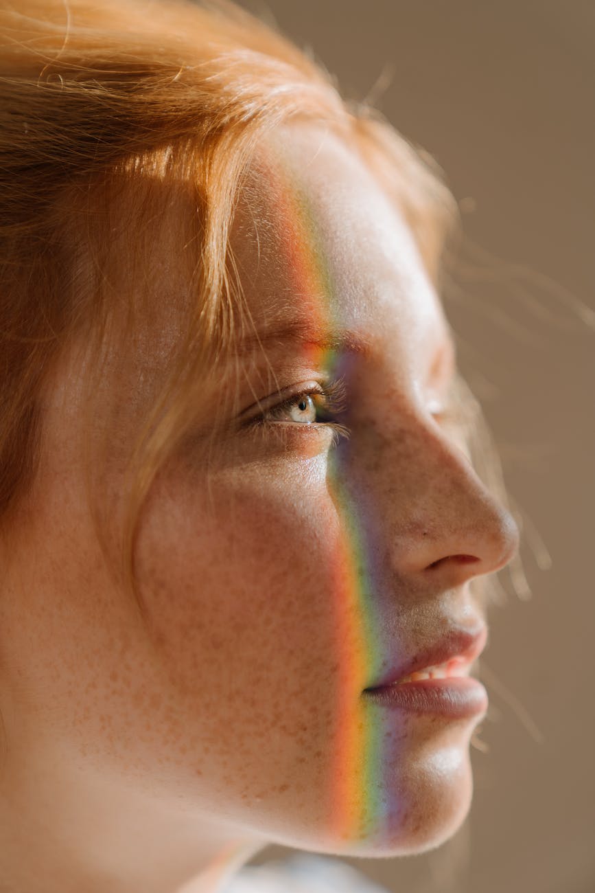 woman with brown hair and silver stud earring